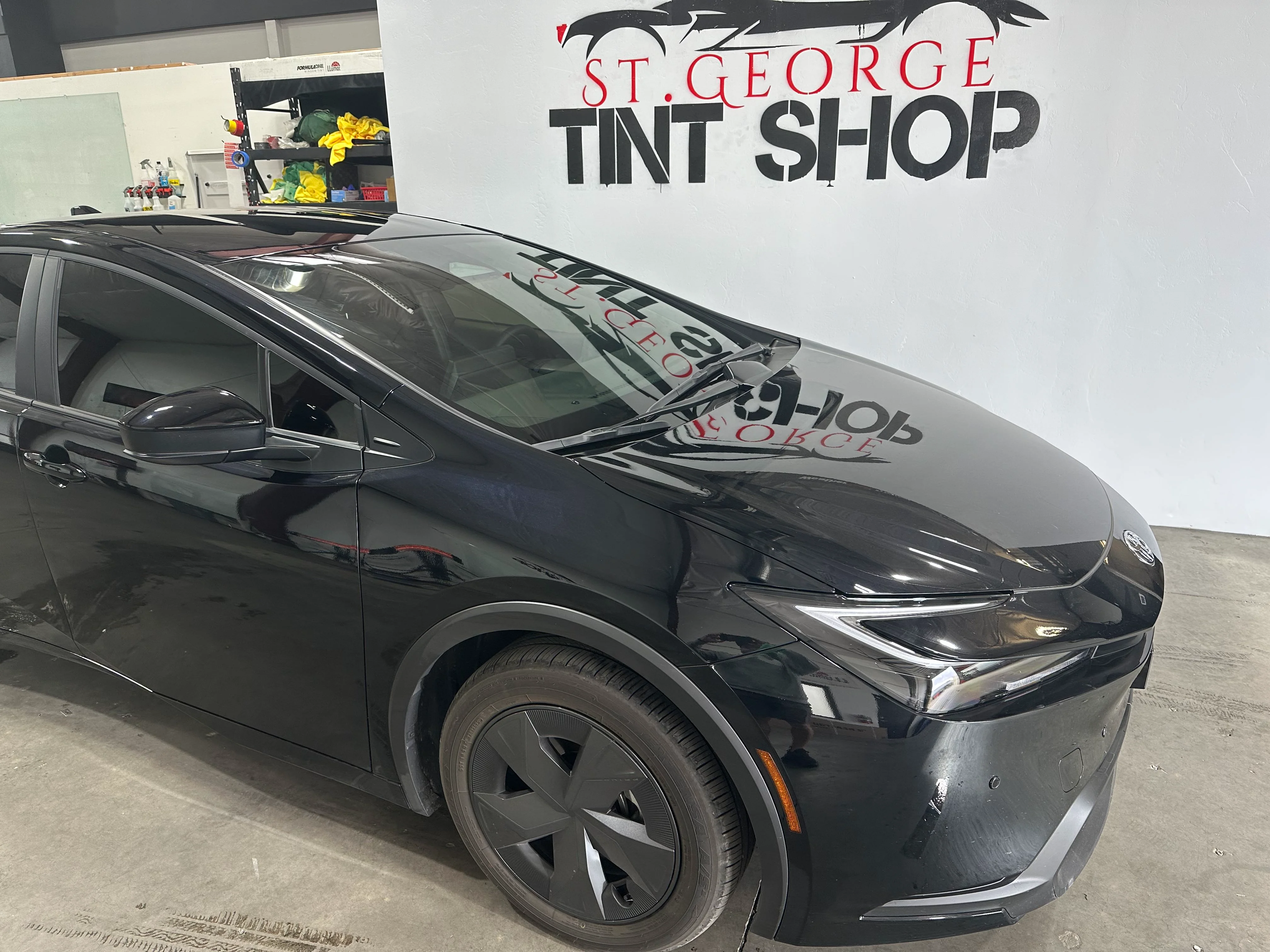 Newly tinted black Toyota Prius sedan at St. George Tint Shop. Professional ceramic window film installation for UV protection.