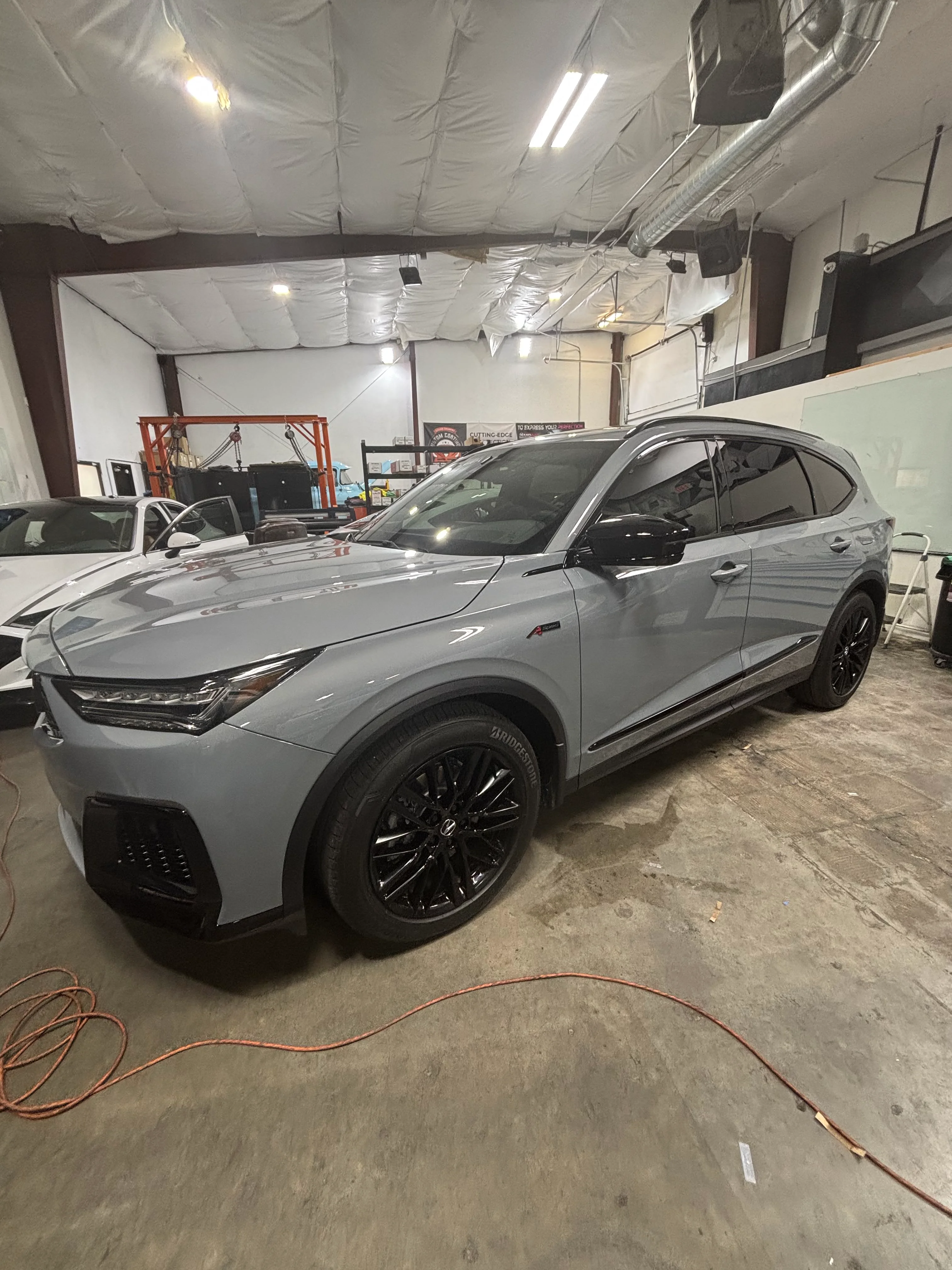 Gray Acura MDX Type S SUV with dark ceramic window tint, expertly applied at a professional shop in St. George, Southern Utah.