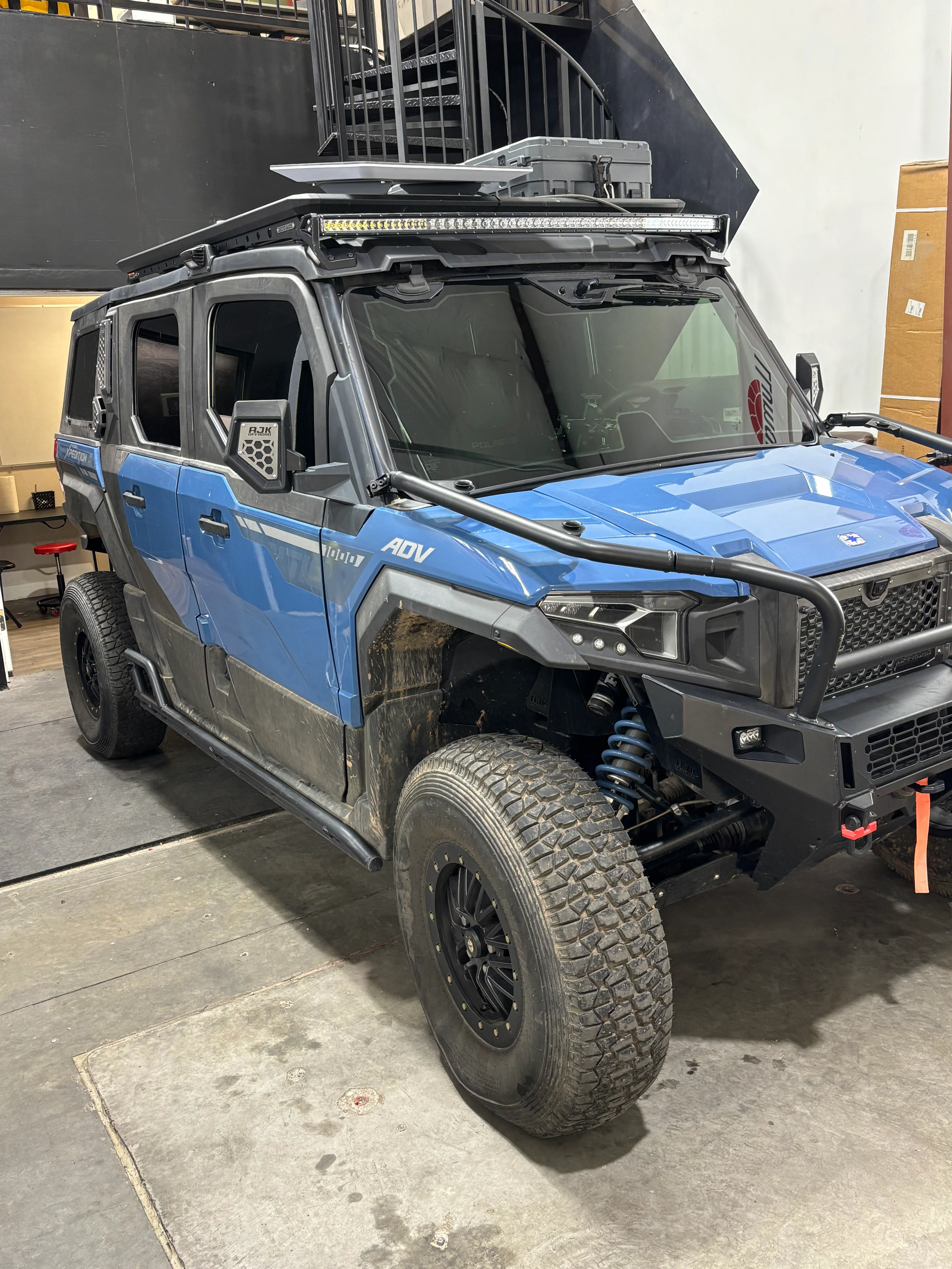 Blue Polaris ADV UTV with professional window tint applied in St. George, Southern Utah.