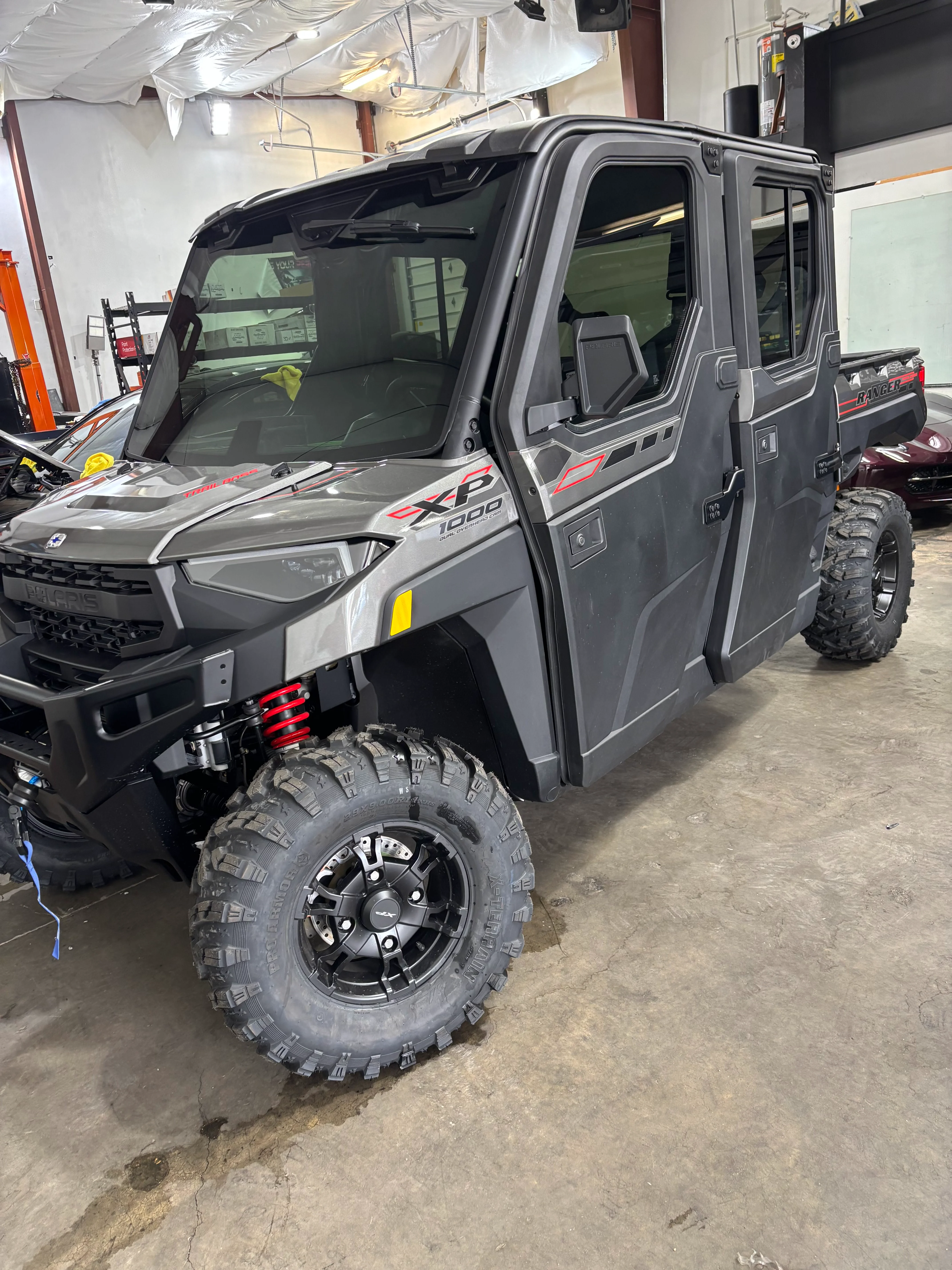 Professionally tinted Polaris Ranger XP 1000 UTV at a tint shop in St. George, Southern Utah, showcasing dark ceramic window film.