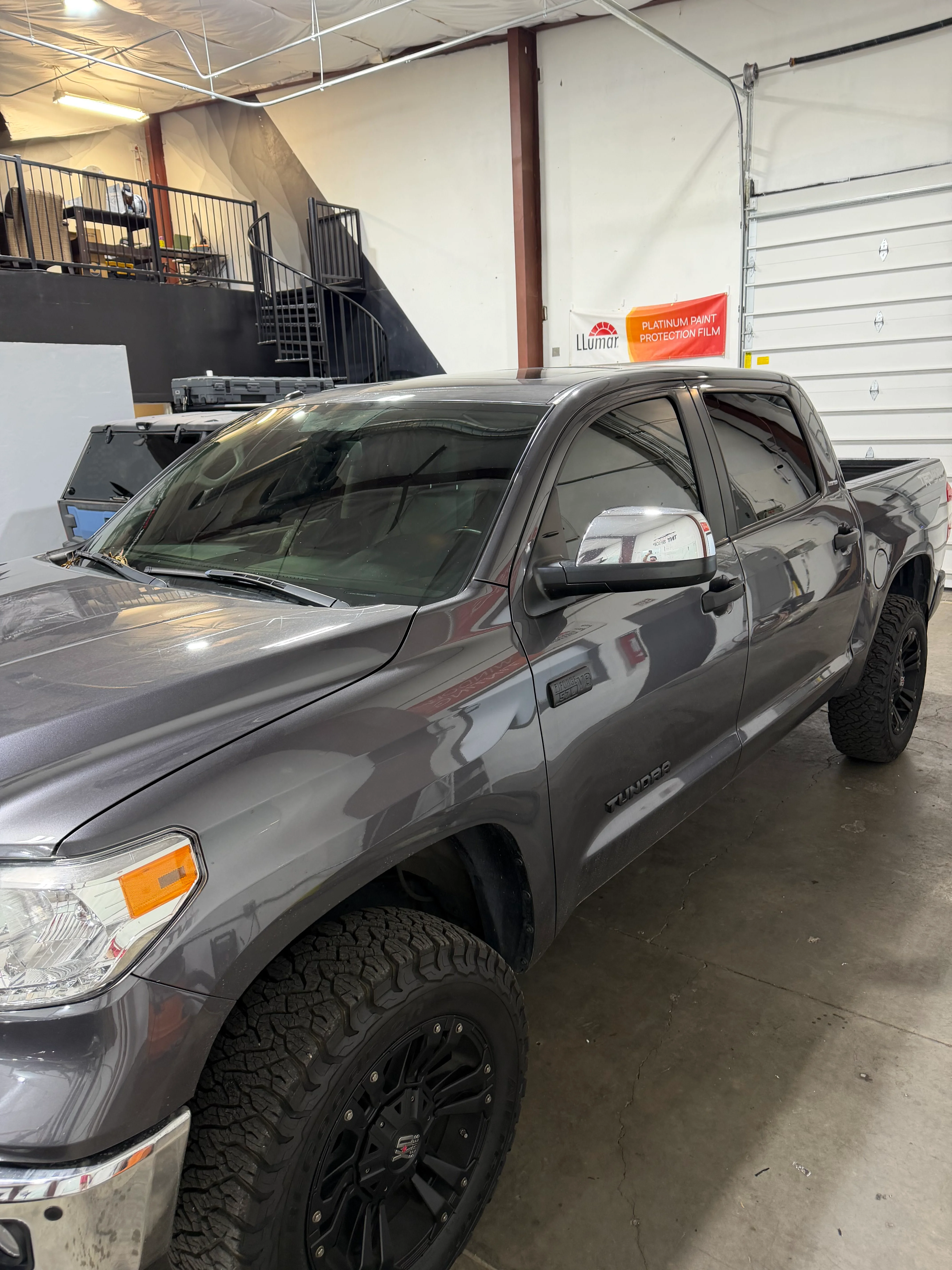 Gray Toyota Tundra pickup truck with dark ceramic window tinting professionally installed at our St. George shop.