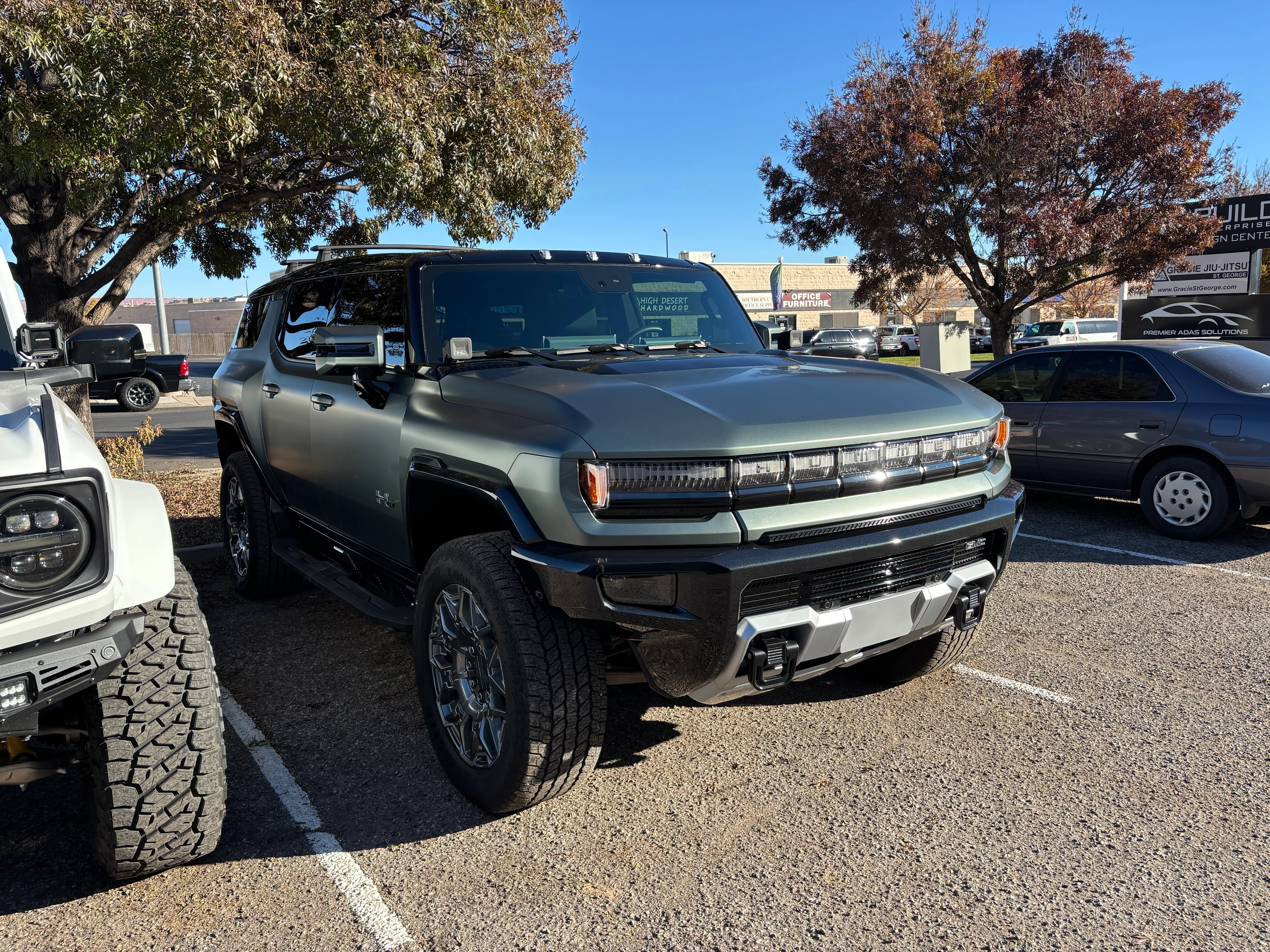 Front view of a gray Hummer EV SUV featuring professionally installed ceramic window tint at a St. George, Southern Utah shop.