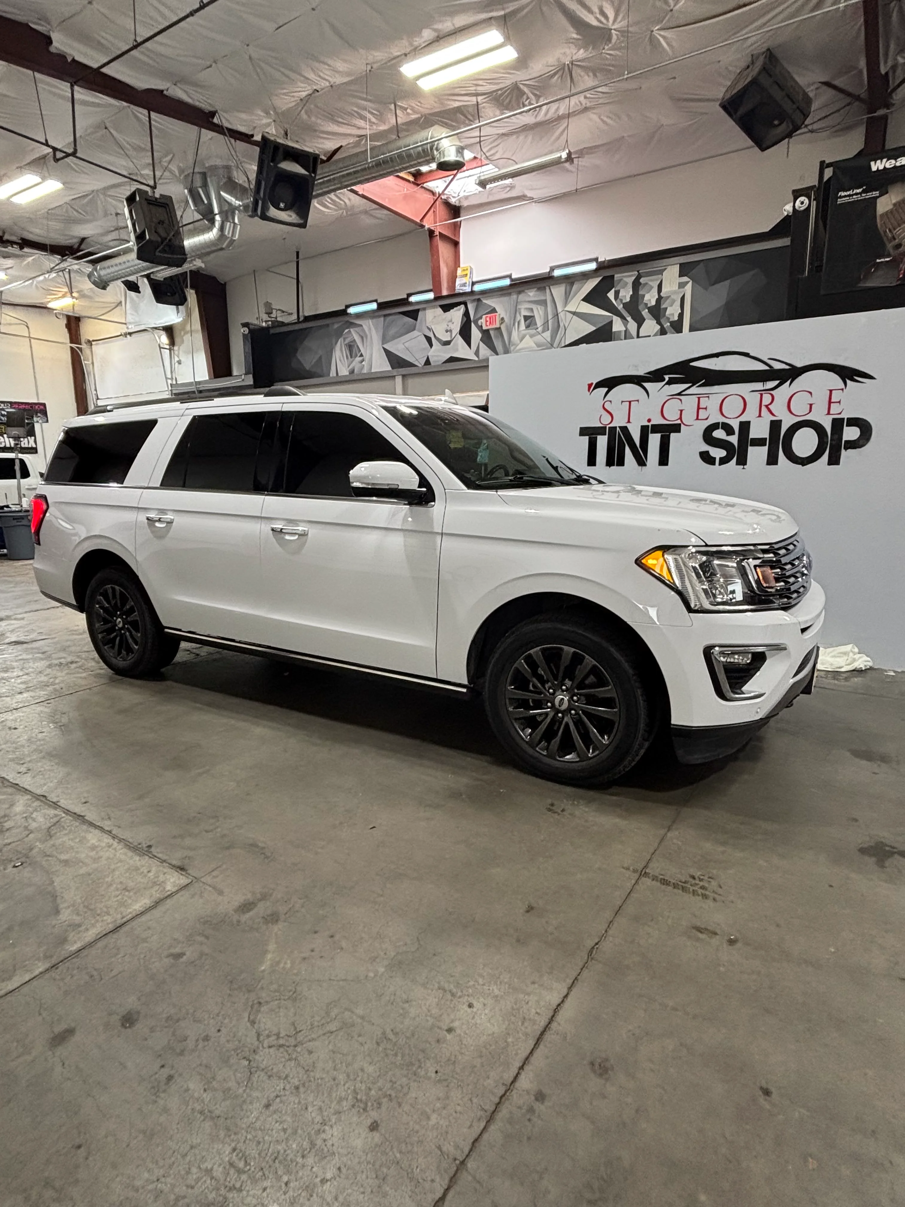 White Ford Expedition SUV with professional ceramic window tinting at St. George Tint Shop in Southern Utah.