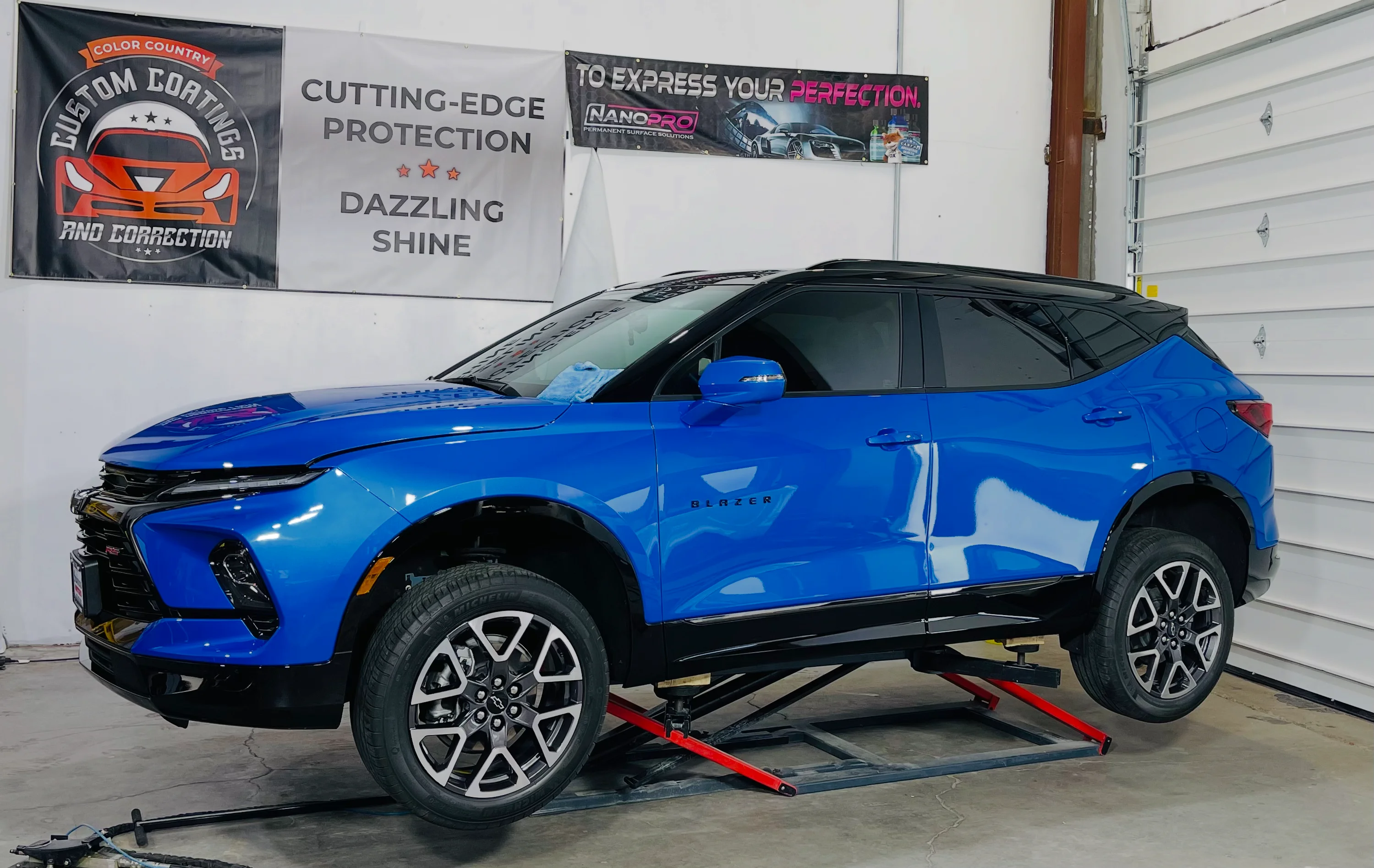 Blue Chevrolet Blazer SUV with sleek window tint, showcasing professional ceramic tint installation in St. George, Southern Utah.