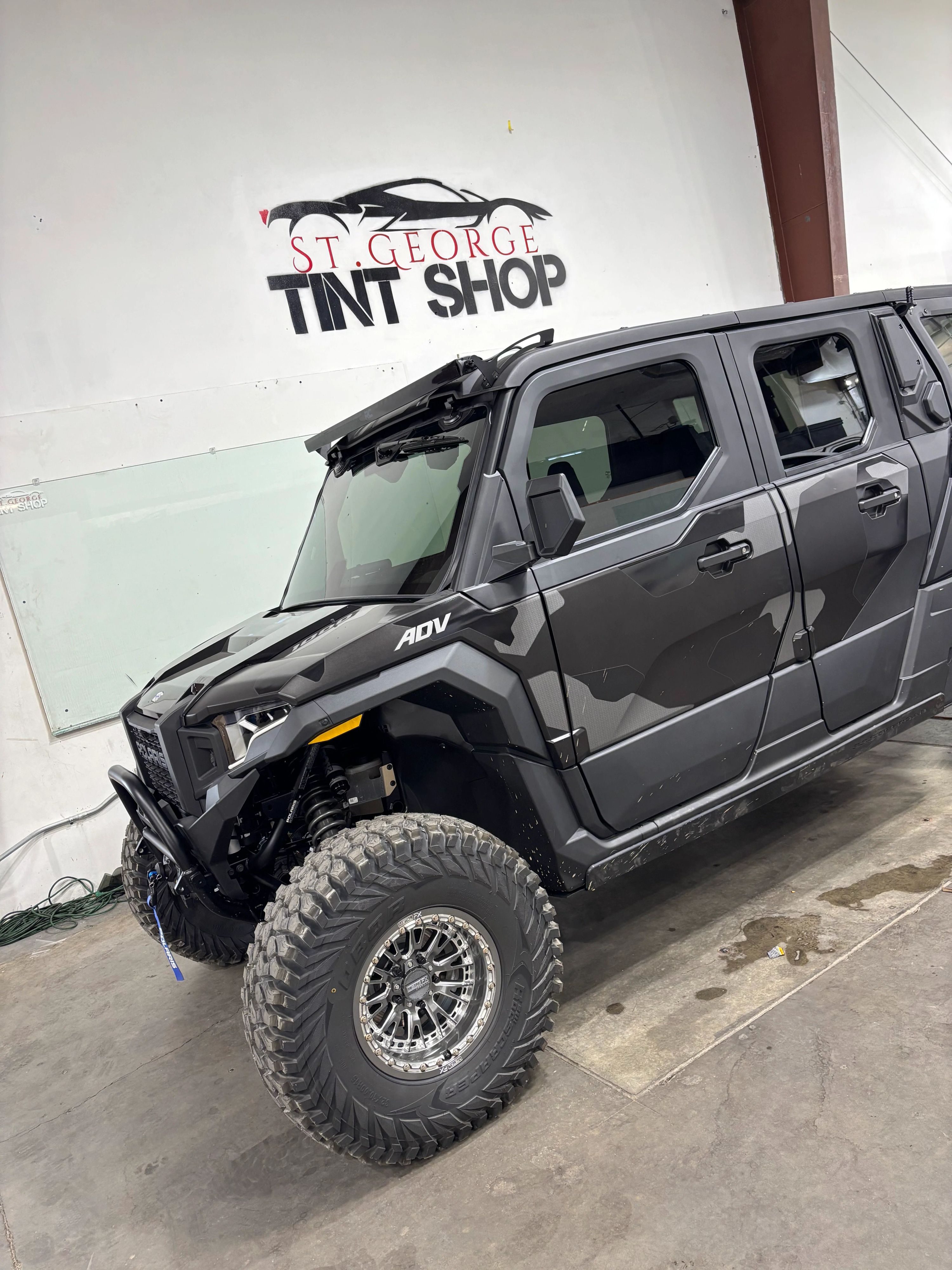 Black Polaris RZR UTV with window tint for desert trails in St. George