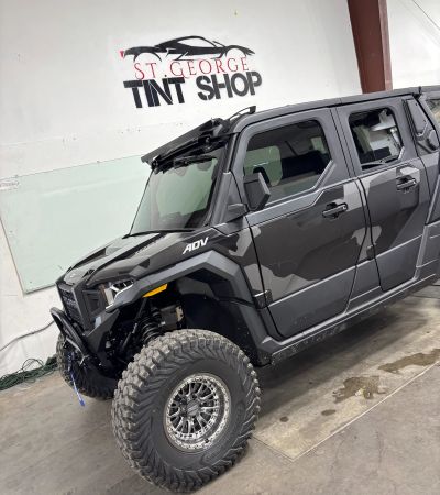 Black Polaris RZR UTV with window tint for desert trails in St. George